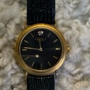 Elegant Gold and Black Women's Watch with tiny diamond